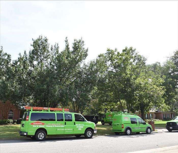 SERVPRO vans at a customers home 